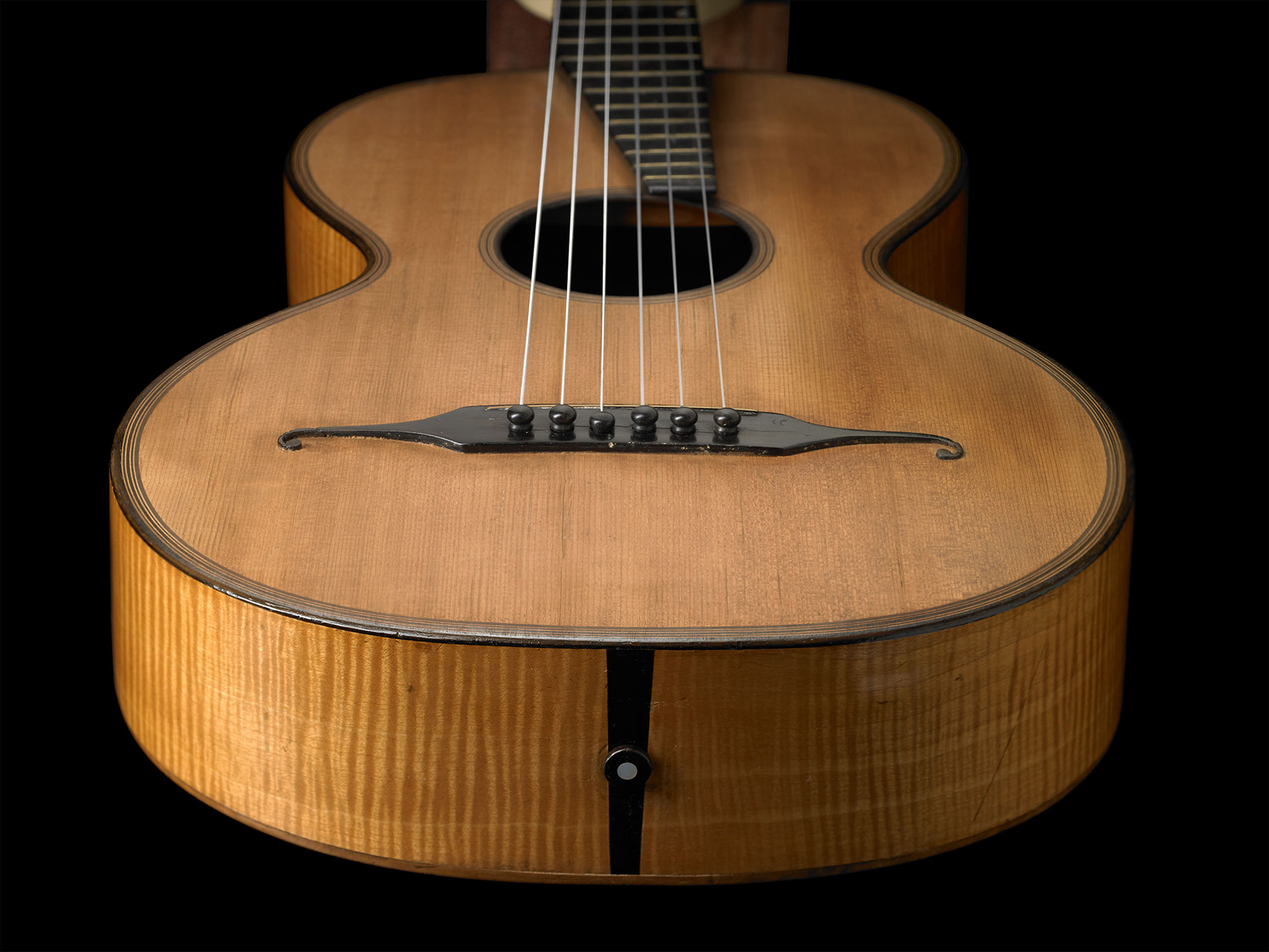 Close-up of a vintage acoustic guitar body